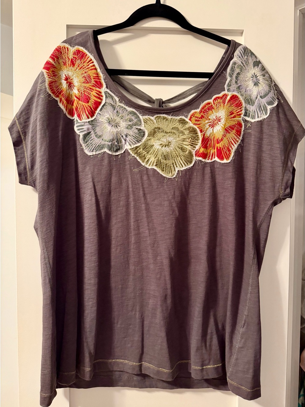 Fun, feminine tee with beautiful flowers and bow.